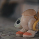 Marcel, a shell with shoes on, carrying a backpack.